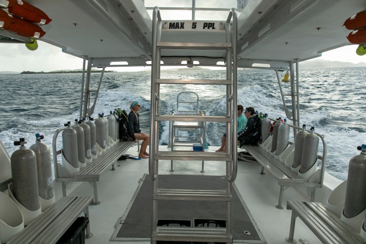 a boat sitting on top of a wooden chair