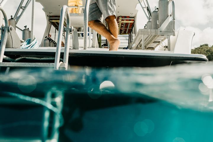 a man riding on the back of a boat