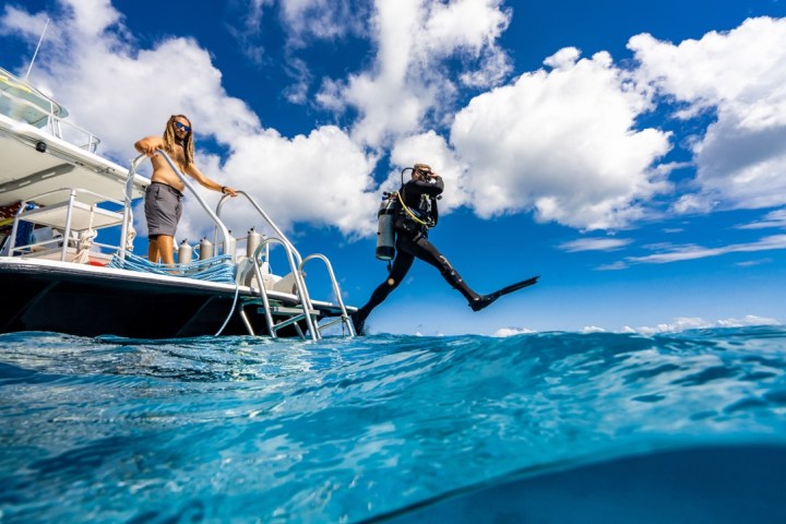 a group of people on a boat in the water