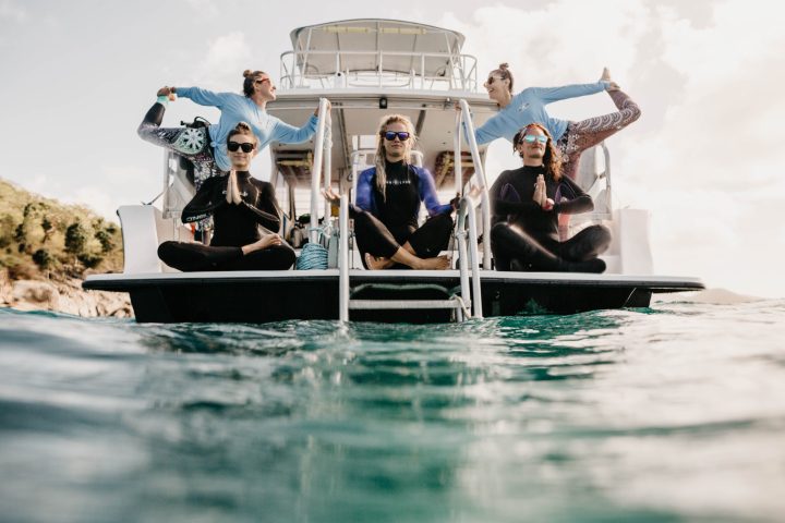 a group of people riding on the back of a boat