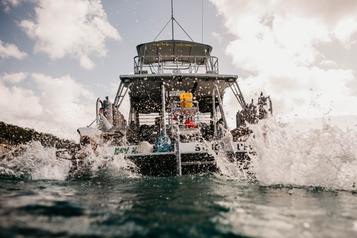 a man riding a wave on a surfboard in the water