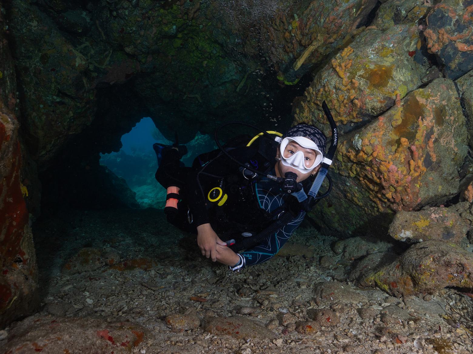 a person lying on a pile of rocks